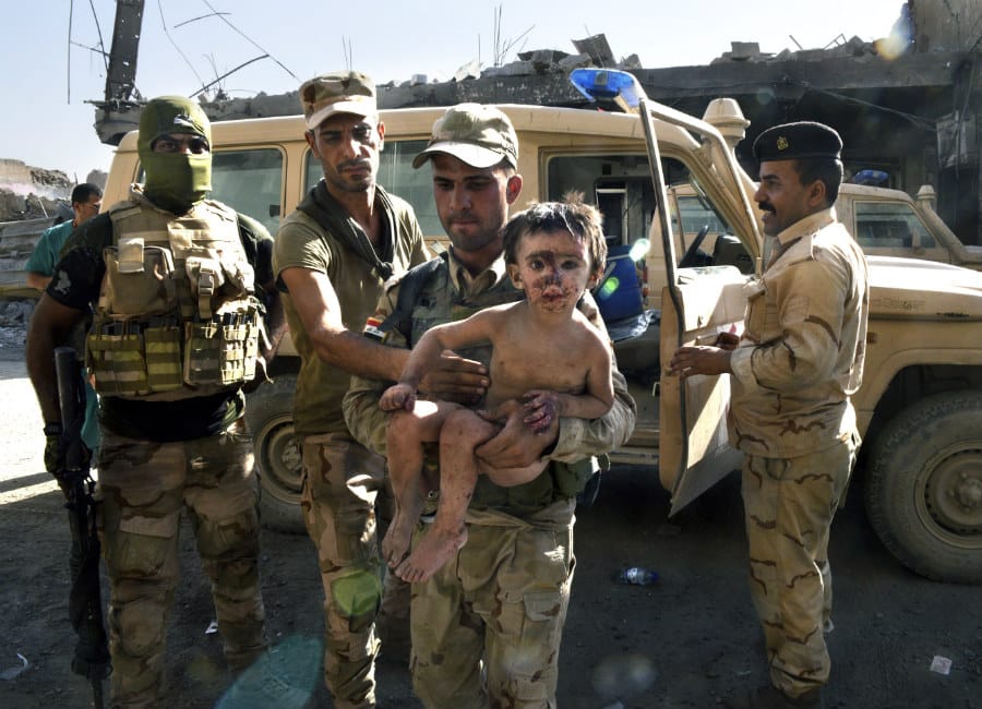 Orphaned toddlers pulled from the rubble in devastated city of Mosul