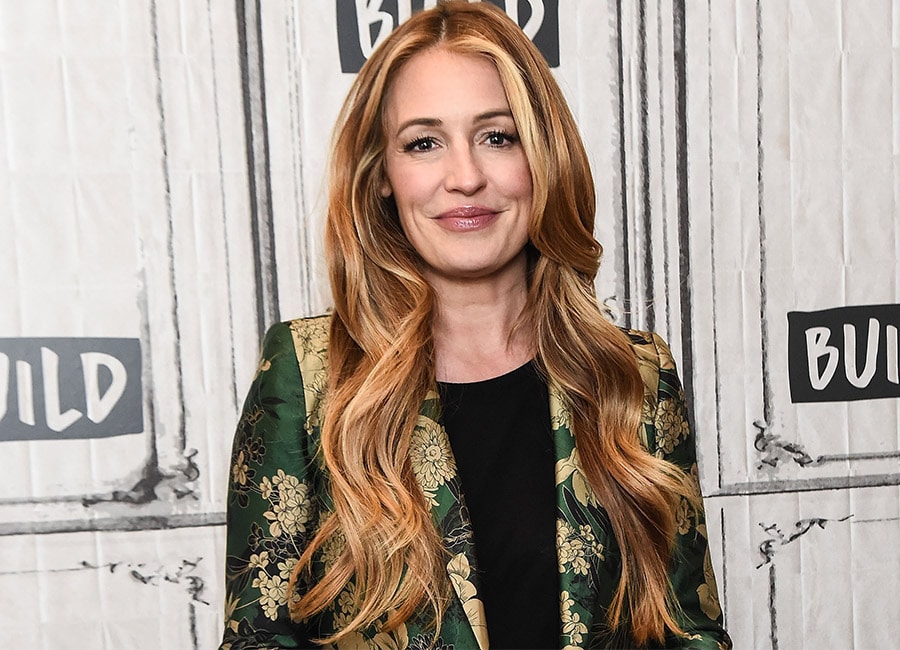 Hot mama: Cat Deeley looks shows off baby bump in yellow bikini