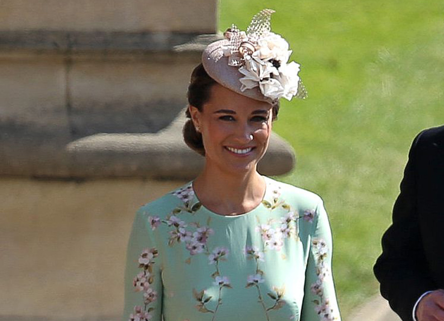 Pregnant Pippa Middleton hides her tiny bump as she arrives for royal wedding