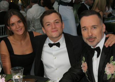 (L to R) Emily Thomas, Taron Egerton and David Furnish. Pic: Getty