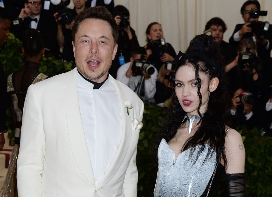 Elon Musk's girlfriend Grimes reveals huge, painful-looking 'alien scars' back tattoo