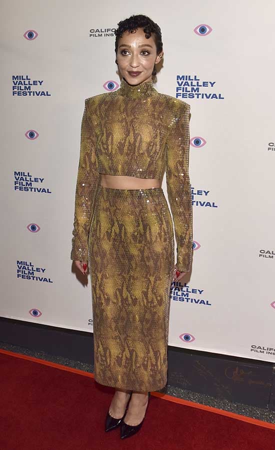 Ruth Negga is seen on the red carpet in an Alessandra Rich sequin animal print crop top and pencil skirt with black heels