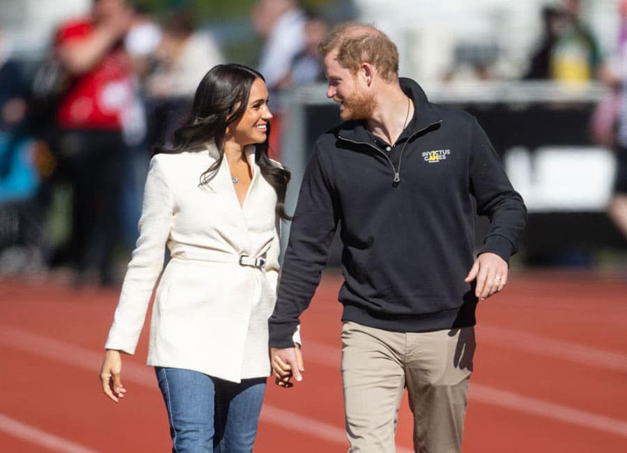 Hand-in-hand and in high spirits Meghan Markle and Prince Harry share the love on day two of Invictus Games