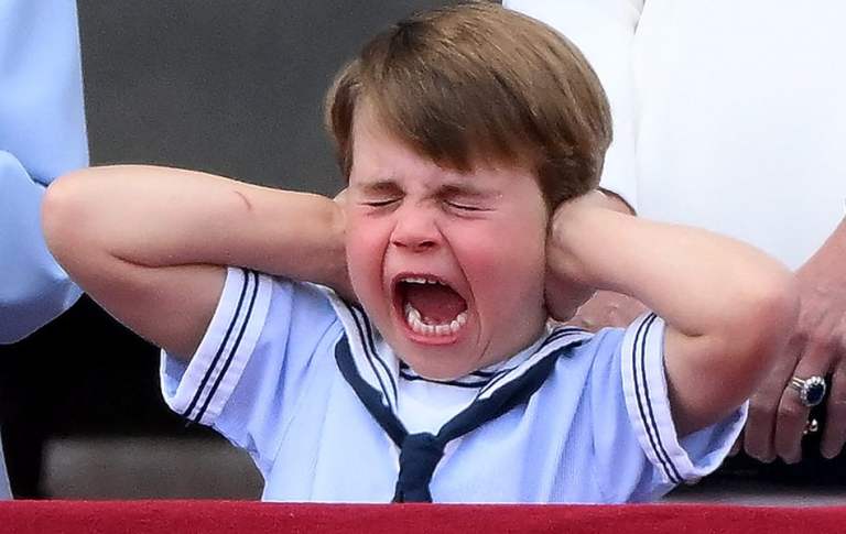 Britain's Prince Louis of Cambridge reacts as he watches a special flypast from Buckingham Palace balcony following the Queen's Birthday Parade, the Trooping the Colour, as part of Queen Elizabeth II's platinum jubilee celebrations, in London on June 2, 2022. - Huge crowds converged on central London in bright sunshine on Thursday for the start of four days of public events to mark Queen Elizabeth II's historic Platinum Jubilee, in what could be the last major public event of her long reign. (Photo by Daniel LEAL / AFP) (Photo by DANIEL LEAL/AFP via Getty Images)