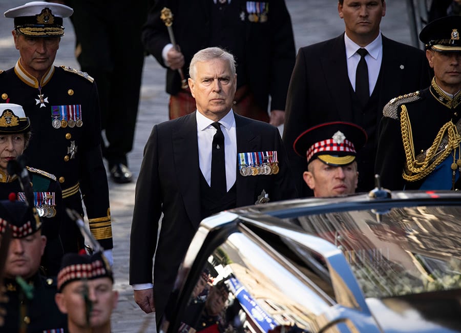'You're a sick old man': Prince Andrew heckled as he walks in procession behind the Queen's coffin