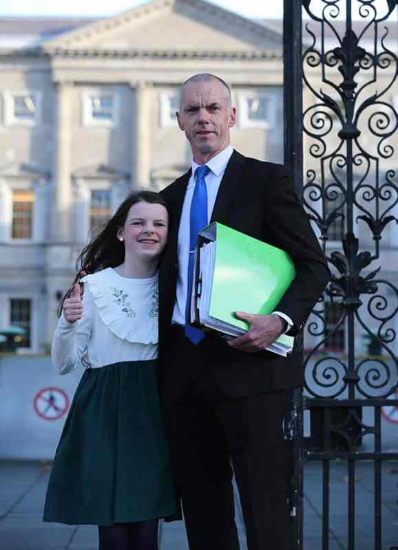 Cara Darmody from Ardfinnan Co Tipperary with her father Mark leaving Leinster House after they addressed the Oireachtas Committee Committee on Autism. Pic Gareth Chaney/Collins