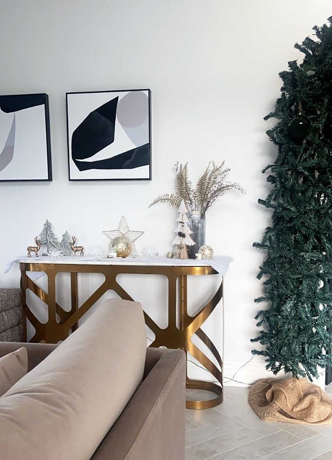 Katie Higgins' sitting room with a Christmas tree arch over the doorway