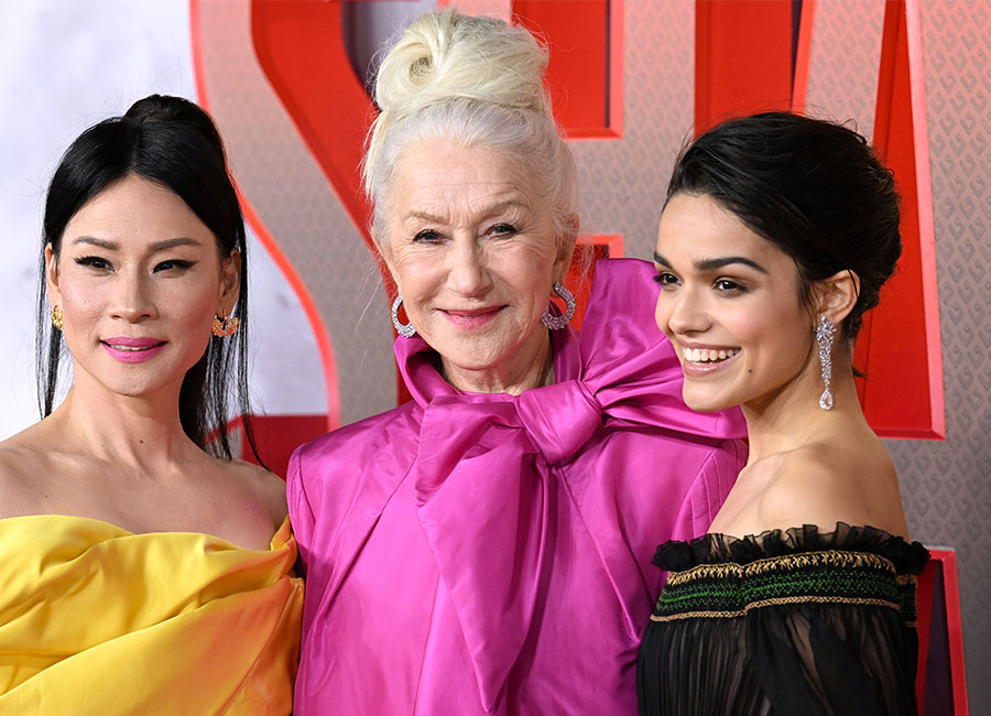 Dame Helen Mirren outshines her Shazam! co-stars in hot pink on the red carpet