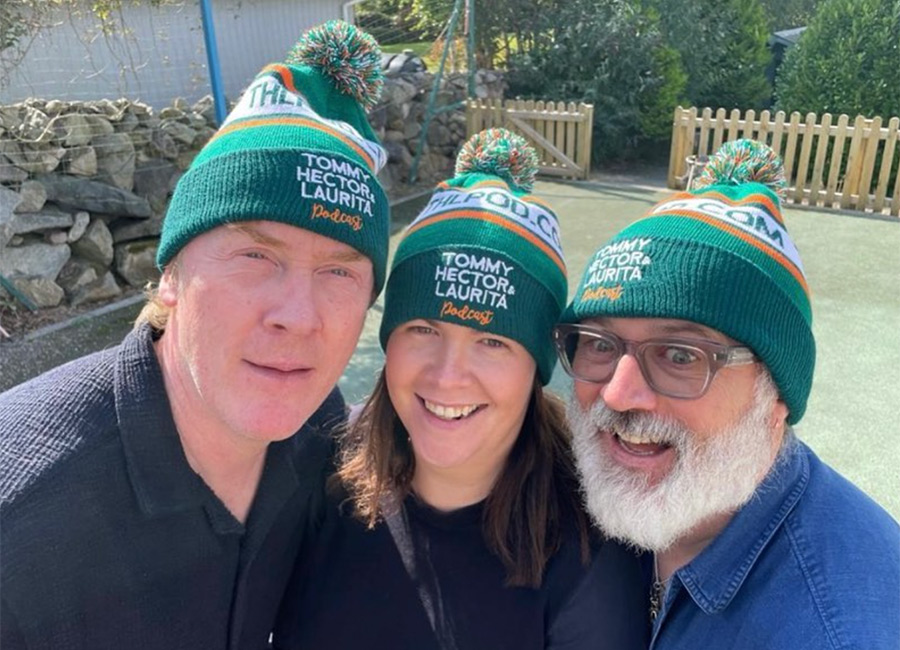 Hector Ó hEeochagáin, Laurita Blewitt and Tommy Tiernan wearing their podcast merch