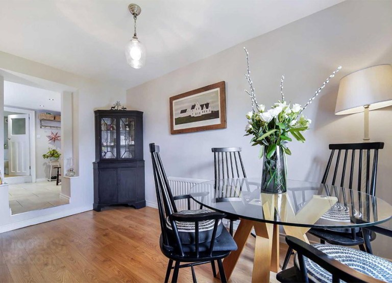 MILFORD ROAD, Ramelton, Bridgend F92 P9K6 €195,000 interior sitting living room carpet fireplace chairs table wooden decor window view