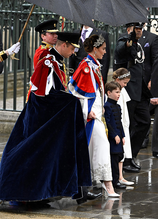 Britain's Prince William, Prince of Wales, Britain's Catherine, Princess of Wales, Britain's Princess Charlotte of Wales and Britain's Prince Louis of Wales arrive at Westminster Abbey in central London