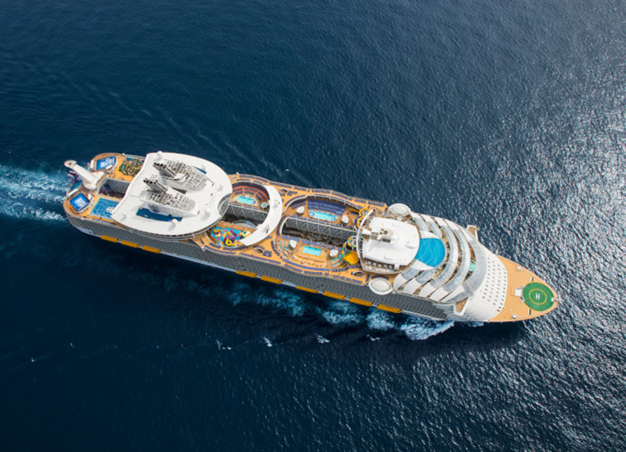 SY, Symphony of the Seas, Aerial view at sea offshore Barcelona, Spain, on April 6, 2018, day, daytime, almost straight top down view, showing partial starboard side