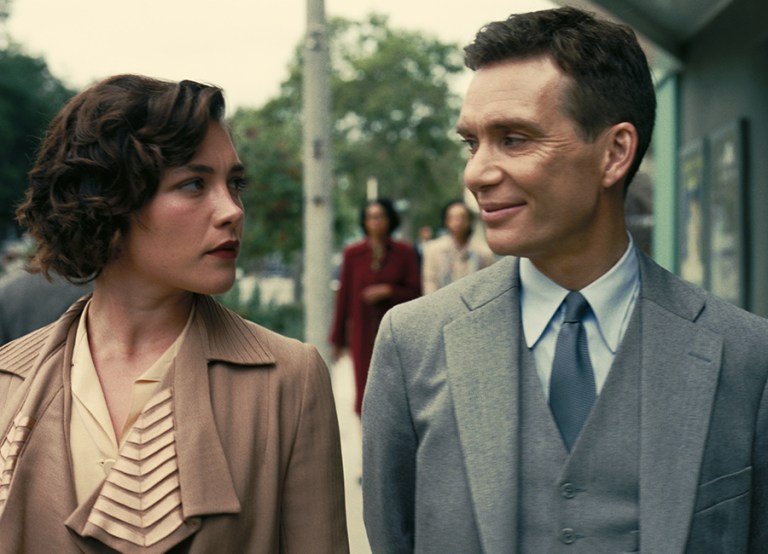 Florence Pugh is Jean Tatlock and Cillian Murphy is J. Robert Oppenheimer in OPPENHEIMER, written, produced, and directed by Christopher Nolan