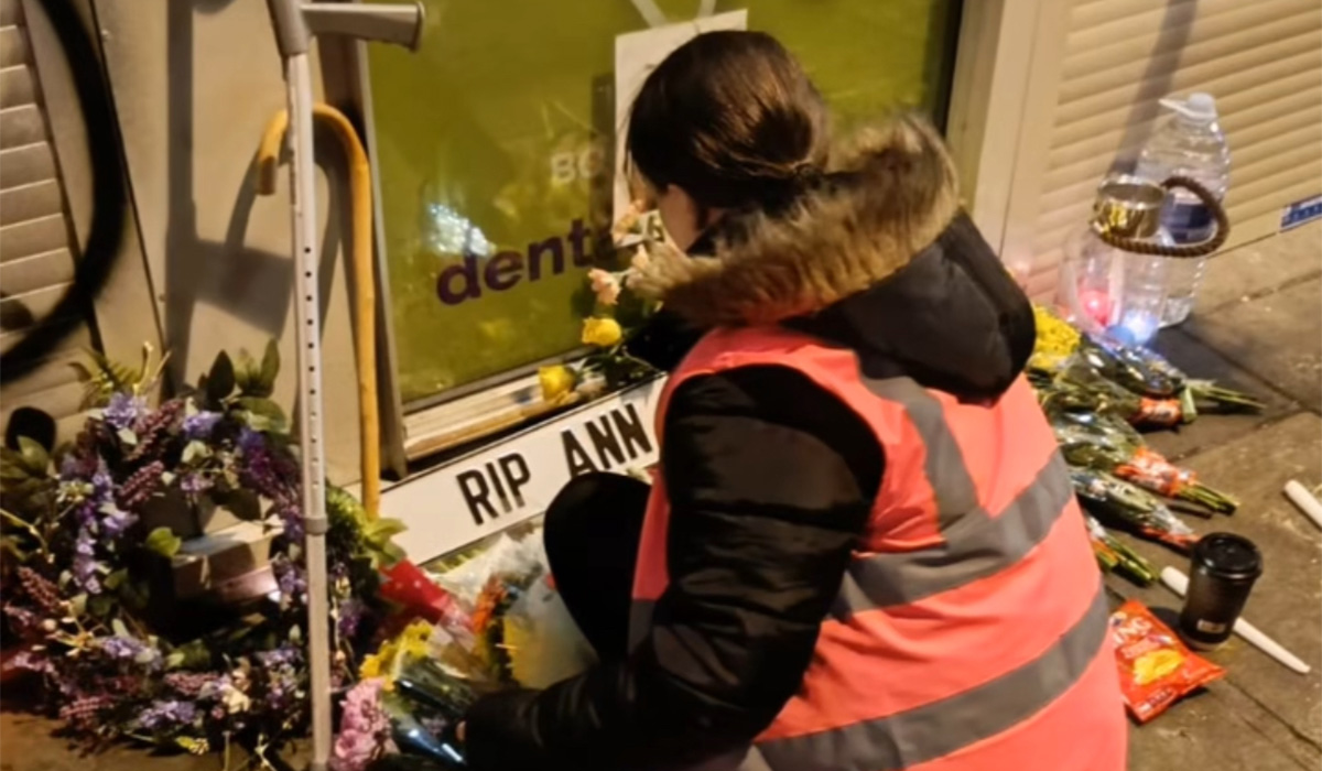 A person stops to lay down some flowers on Aungier Street in Dublin. Pic: Liberty Soup Run/Instagram