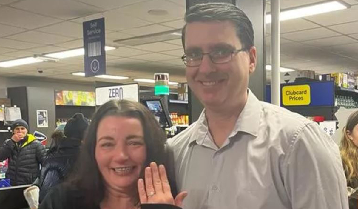 Tesco worker gets down on one knee in the bagging area