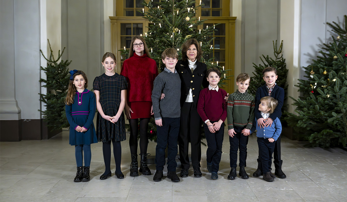 Queen Silvia of Sweden joined by her grandchildren to decorate the Royal Palace trees