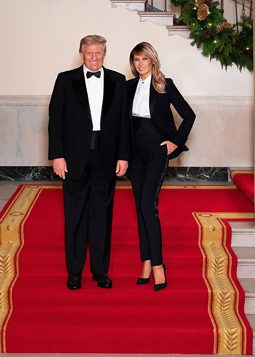 President Donald Trump and First Lady Melania Trump pose for their official Christmas portrait on the Grand Staircase in the Grand Foyer of the White House. Pic: REX