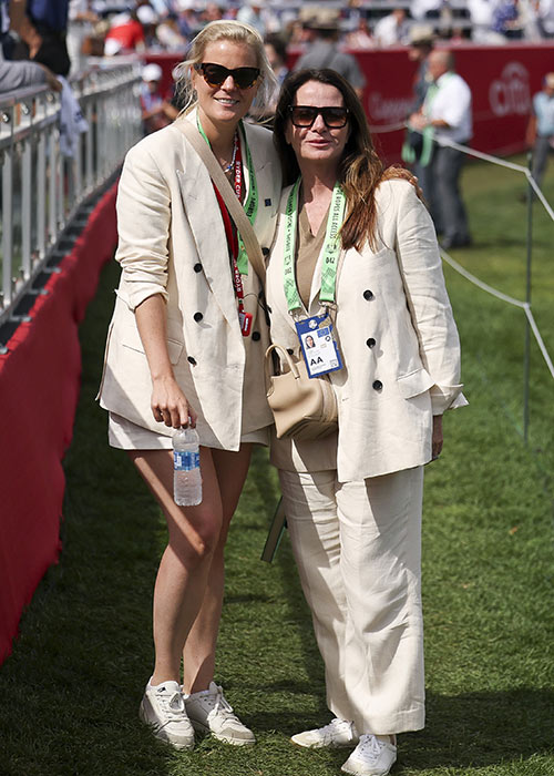 Wives and Partners of Team Europe, Grace Barber and Clare Fleetwood pose for a photo on the first tee during the Saturday morning foursomes matches of the 2025 Ryder Cup. Pic: Getty Images
