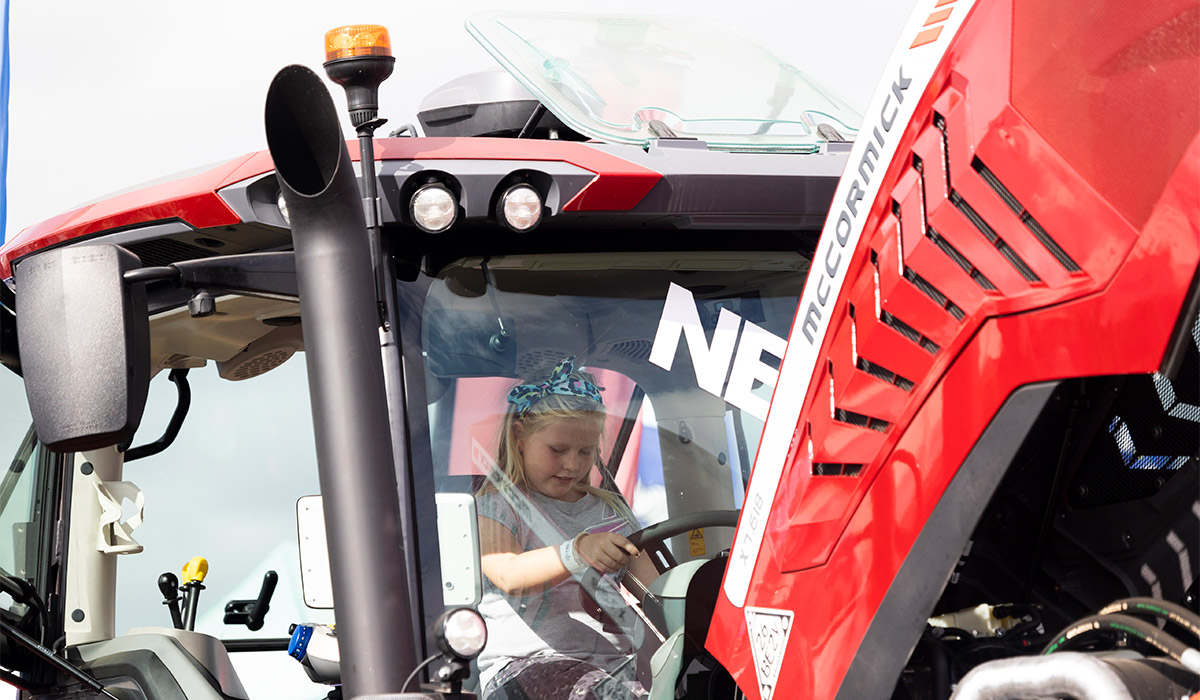 Sophia Downey, 9, tries out a tractor at the National Ploughing Championships in 2022. Pic: Sam Boal/RollingNews.ie