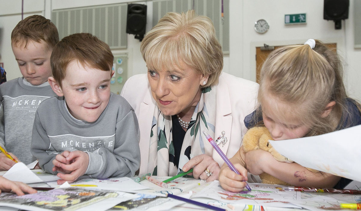 Minister for Rural and Community Development and Minister for Social Protection Heather Humphreys TD with (L to R) Twins James and Bobby Jessop (4) & Mia Hilliard 5 from Ballyoran Ballyroan Community & Youth Centre. Pic: Gareth Chaney/ Collins Photos